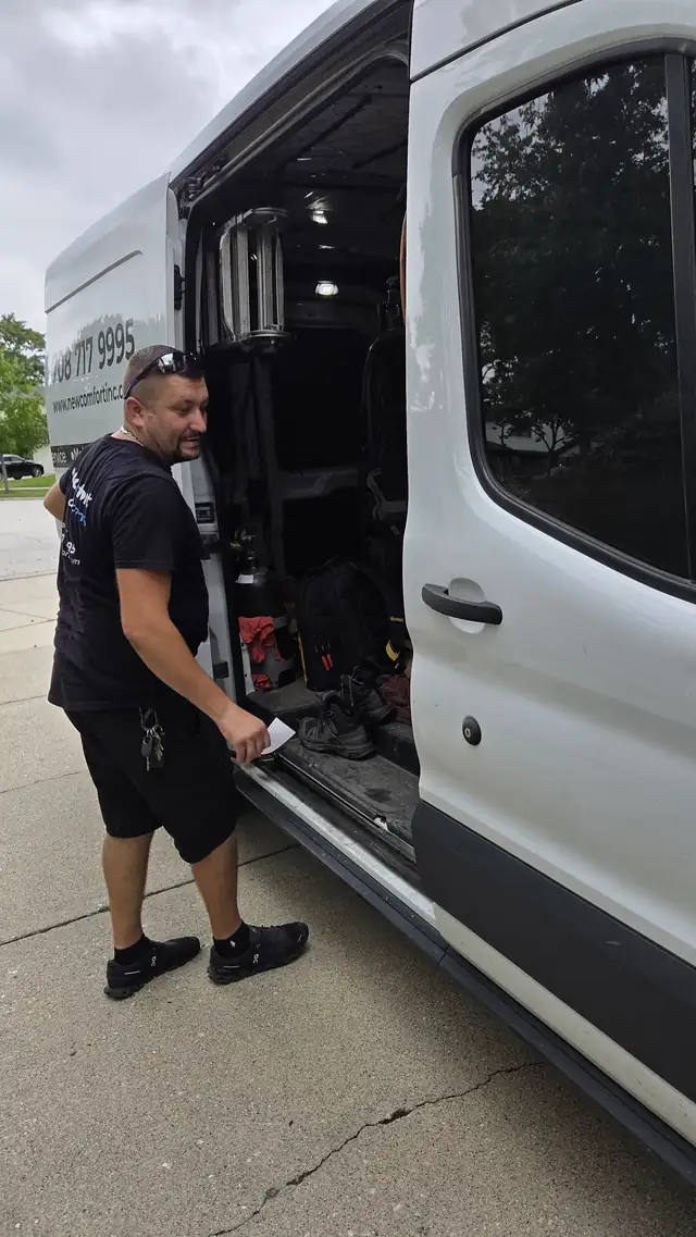 New Comfort technician getting parts from the service van