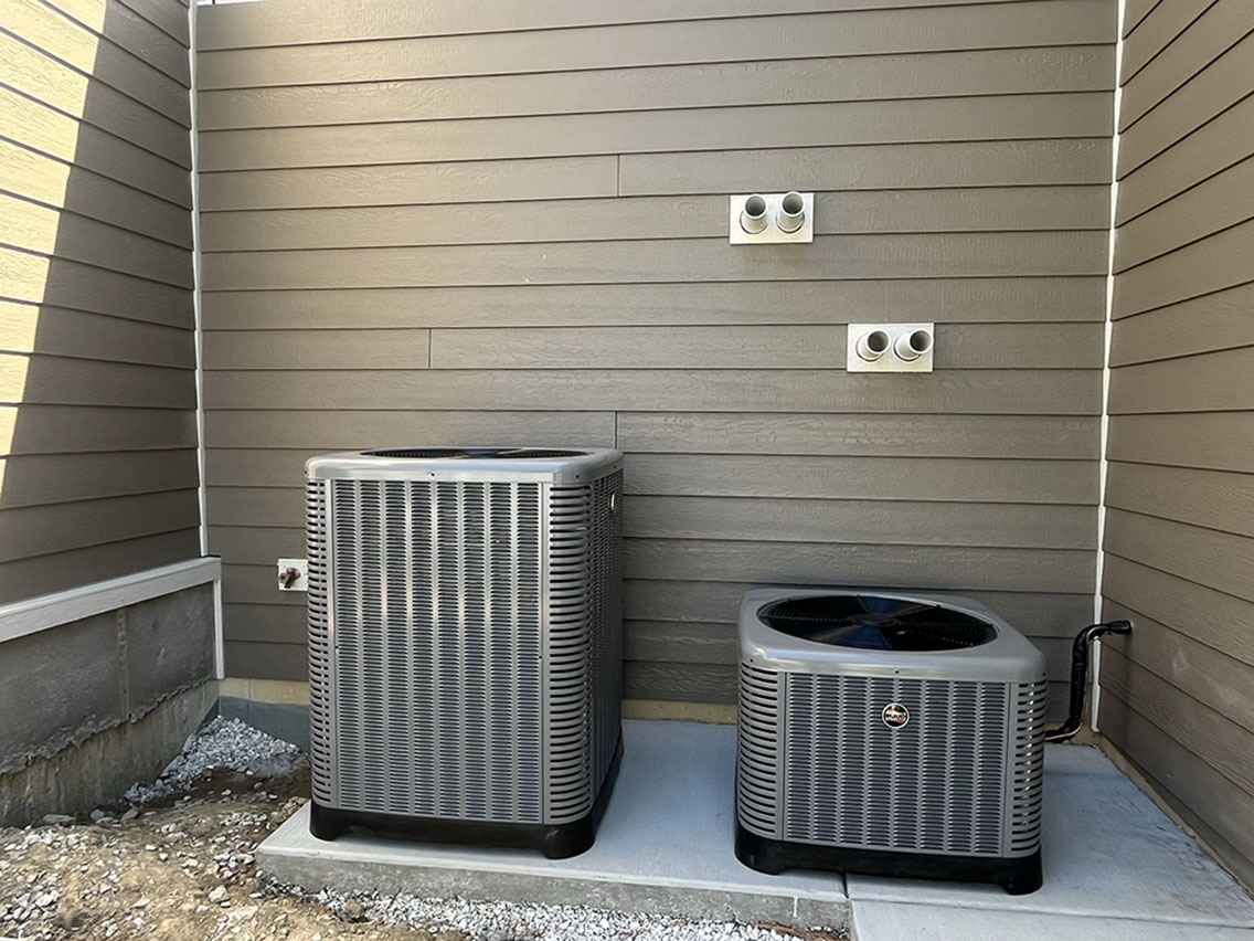Two matched condensers after an AC unit installation in Downers Grove IL