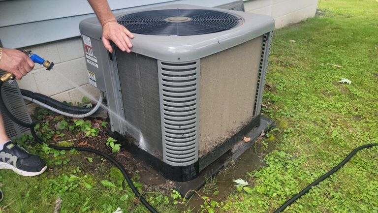 Seasonal AC tune-up on an outdoor unit in Hickory Hills