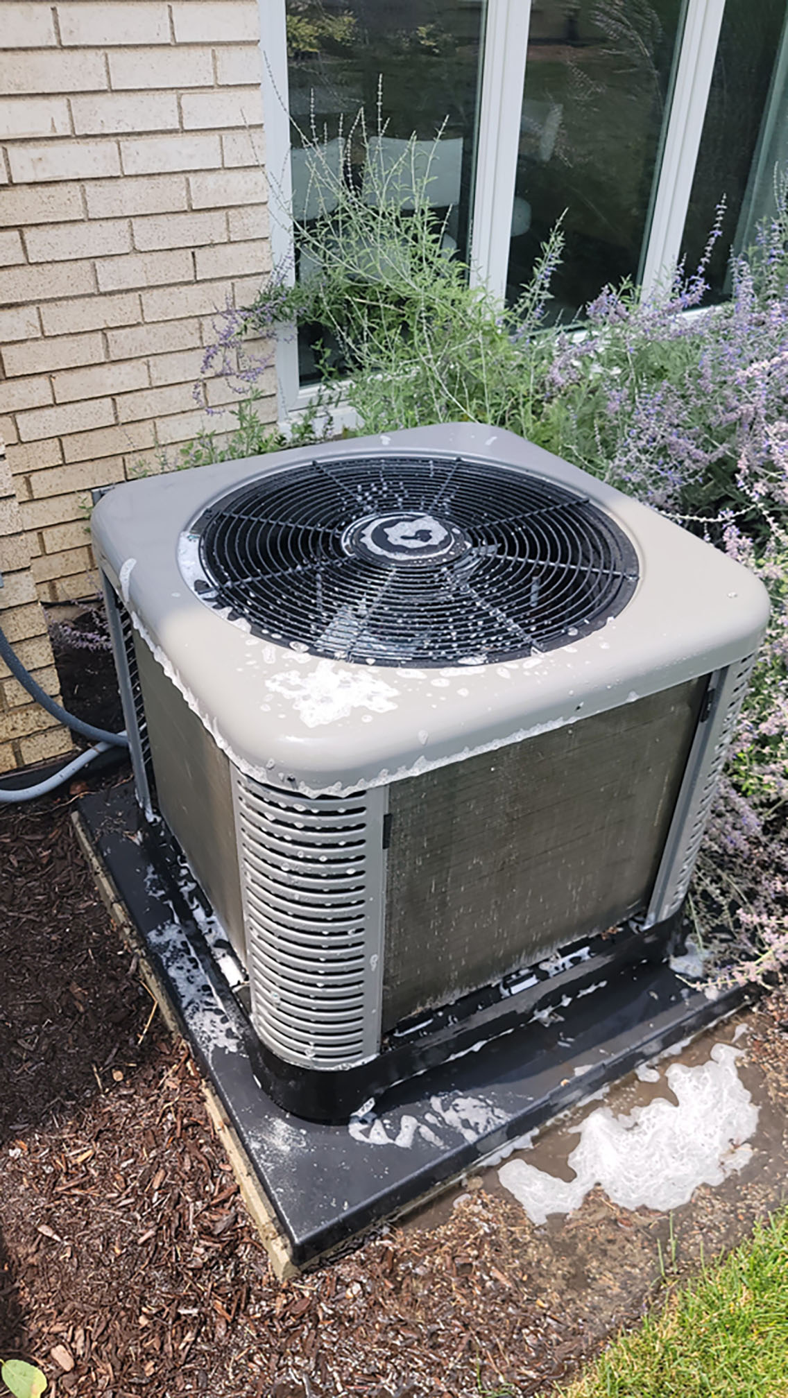 Outdoor AC condenser after coil cleaning during a seasonal air conditioner tune-up in Hinsdale IL