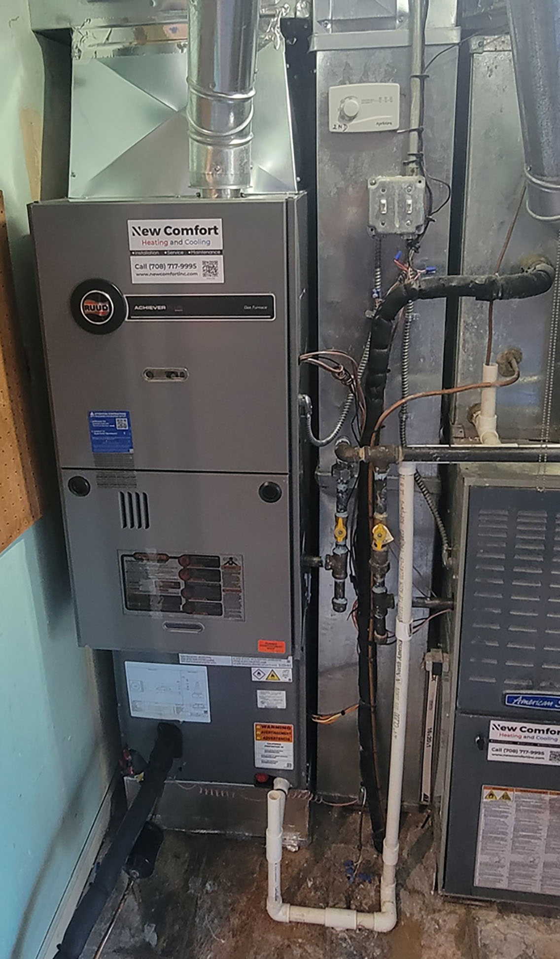 Newly installed gas furnace with New Comfort label in a basement - HVAC services Orland Park IL