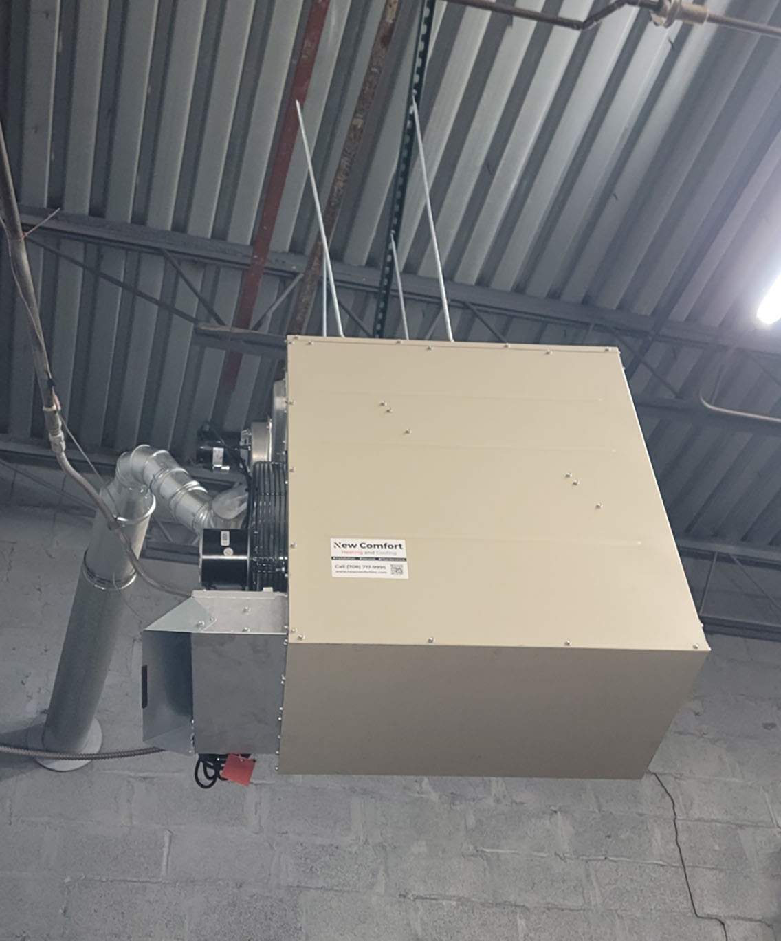 Gas-fired unit heater installed by New Comfort in a Lemont IL building - HVAC services Lemont for garages and shops