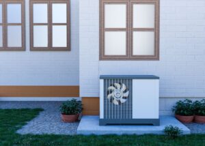 Outdoor HVAC condensing unit installed next to residential house