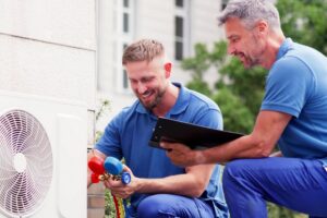 appliance and hvac repair technician working on home systems